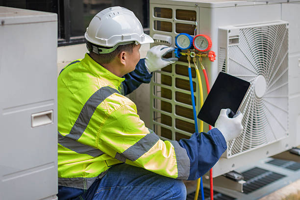 Professional Heat Pump Repair technician working in Brick, NJ
